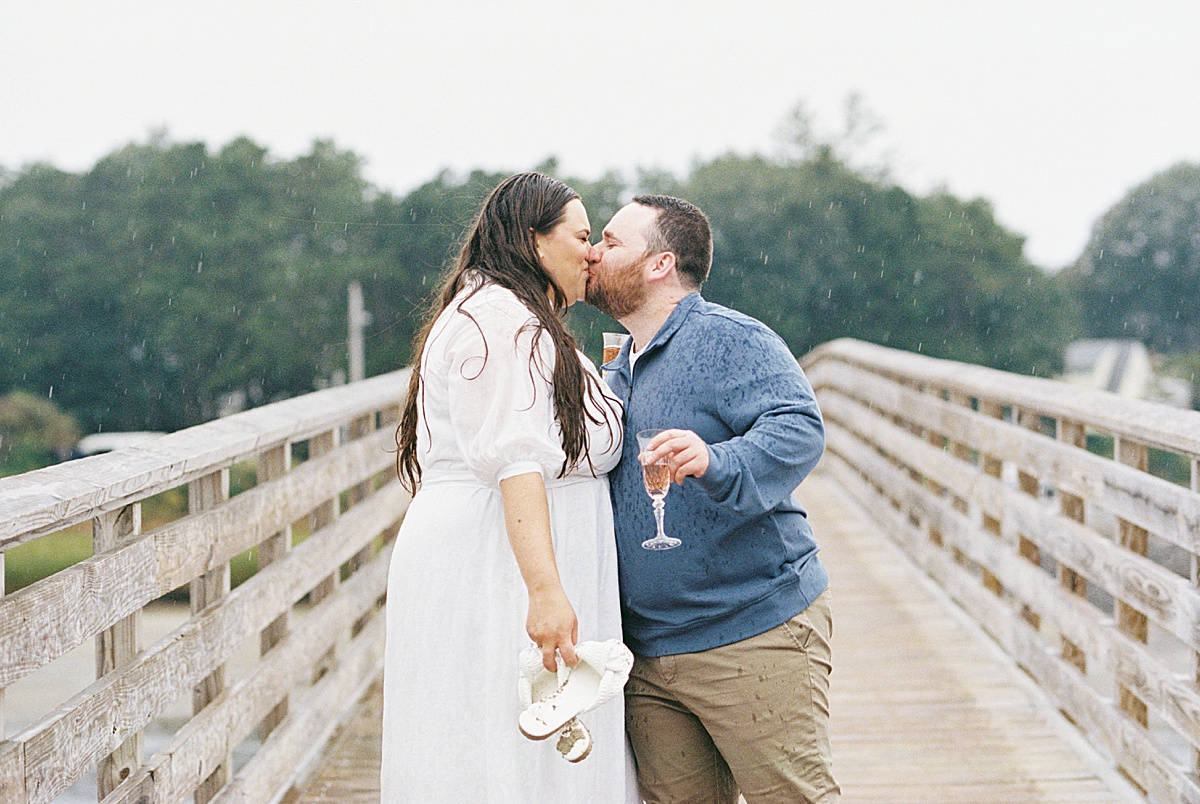 Man and woman share a kiss for Coastal Maine Wedding Photographer