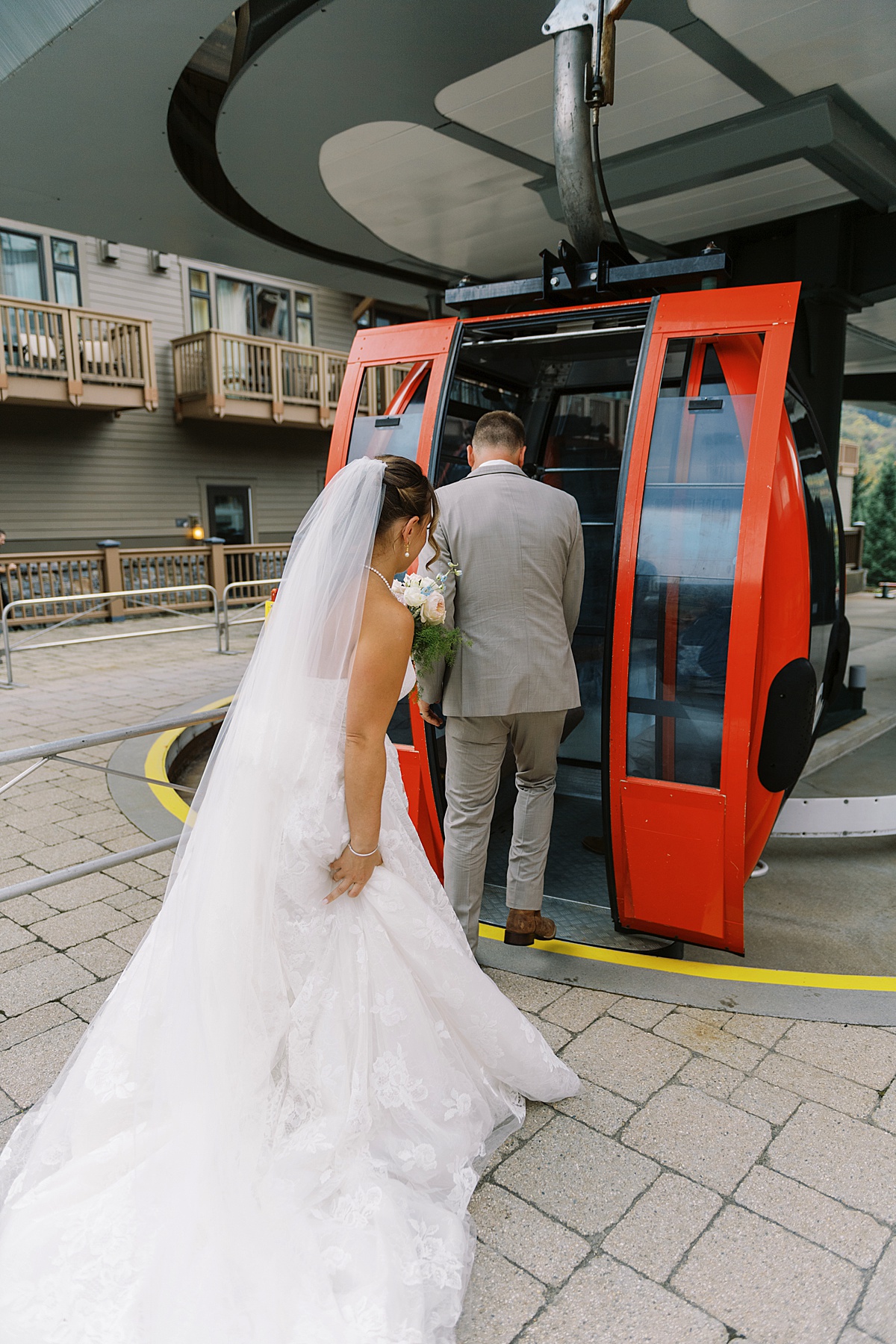 Couple enters gondola at The Lodge at Spruce Peak