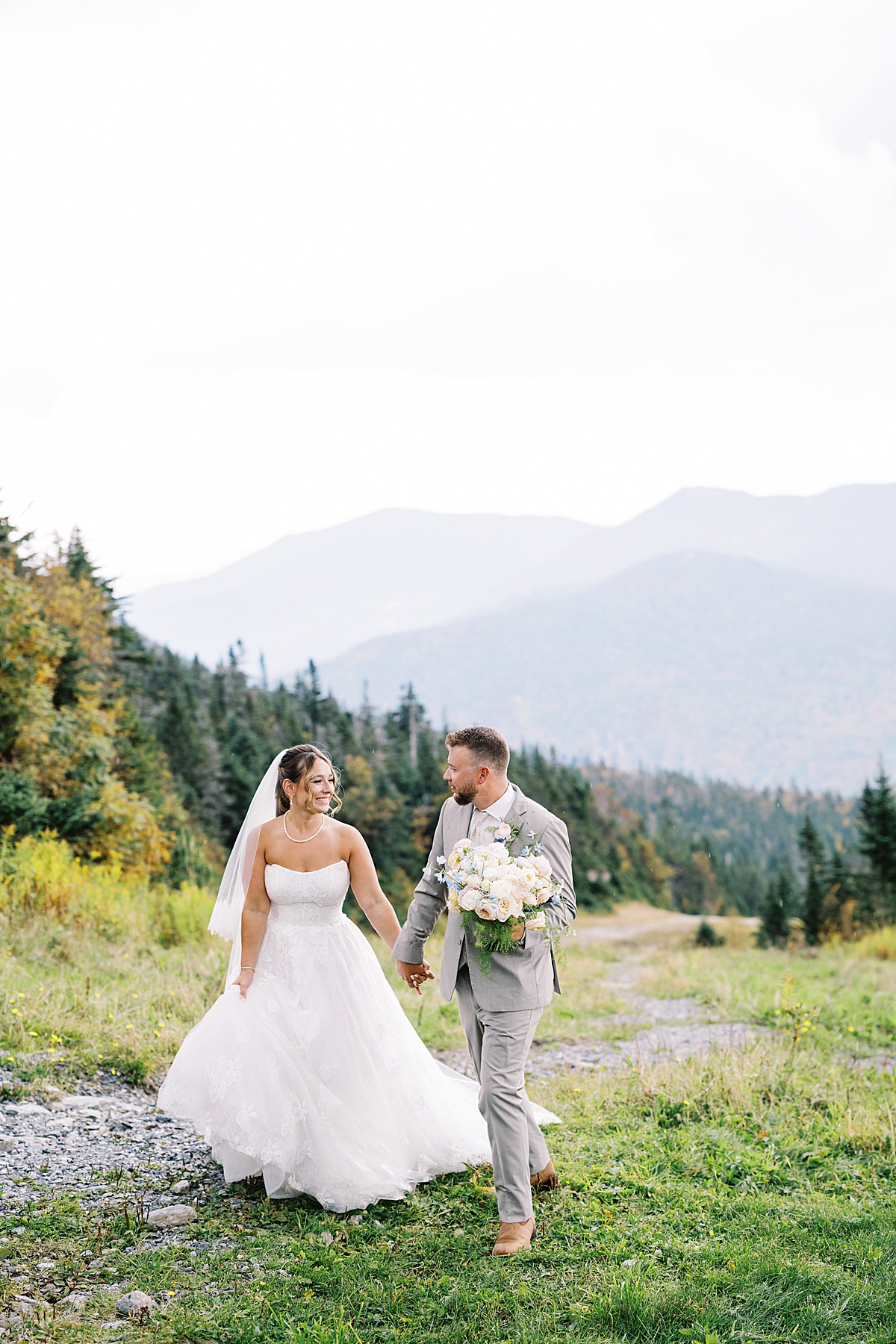 Couple walk together hand in hand for Lynne Reznick Photography