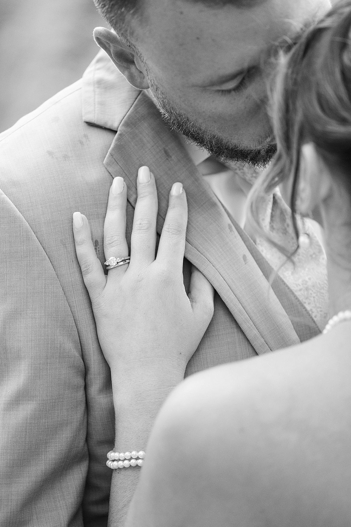 Woman lays her hand on mona's chest for Boston Wedding Photographer