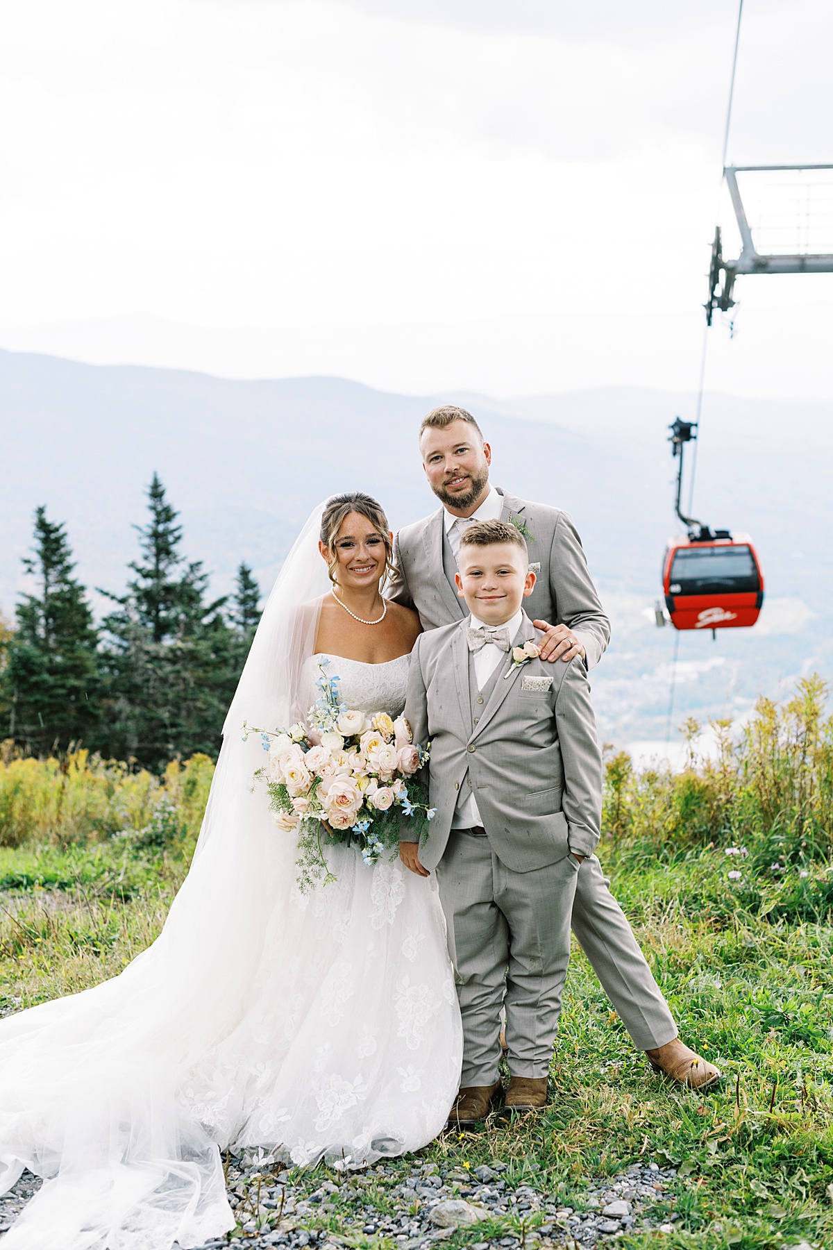 Happy family stands together for Lynne Reznick Photography