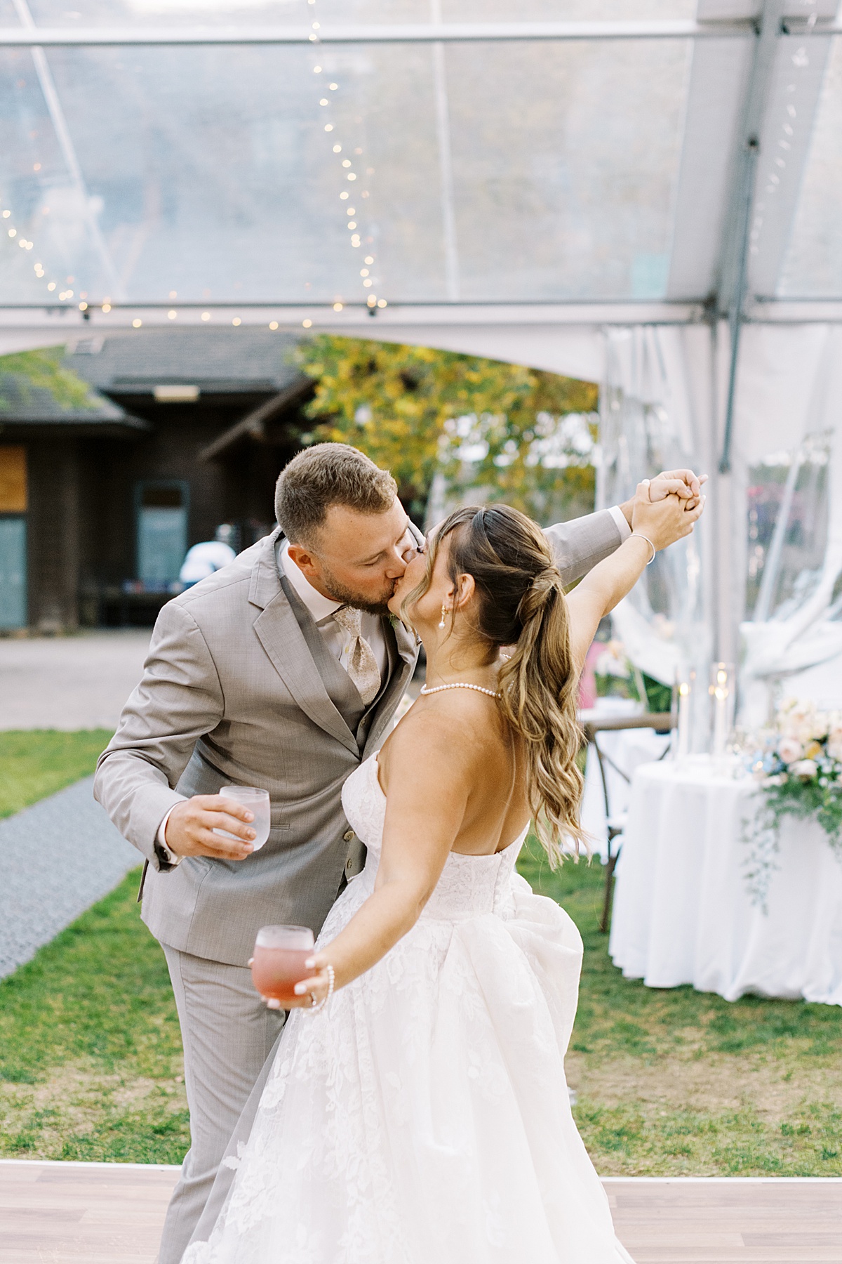 Bride and groom share a kiss while dancing at The Lodge at Spruce Peak