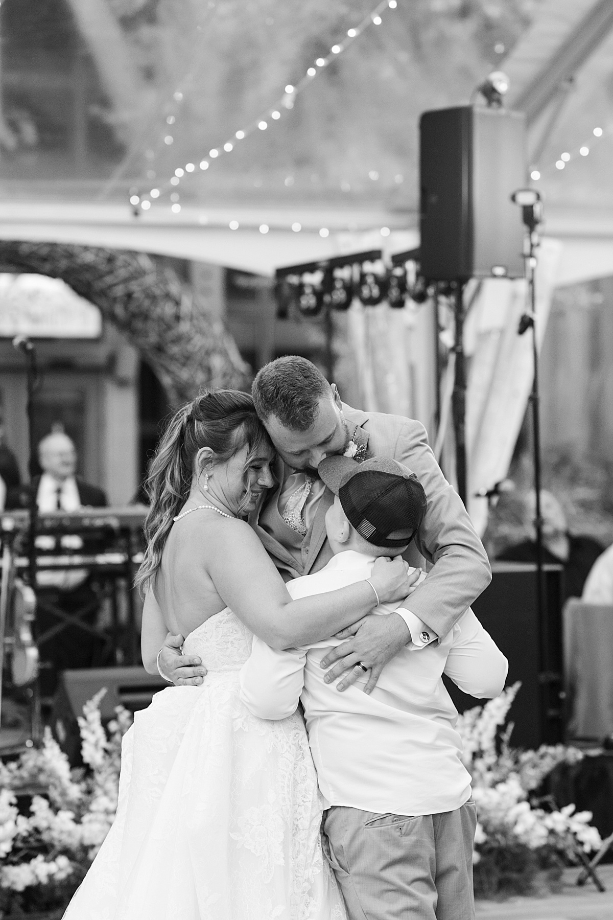 Family hold each other close while dancing together for Boston Wedding Photographer