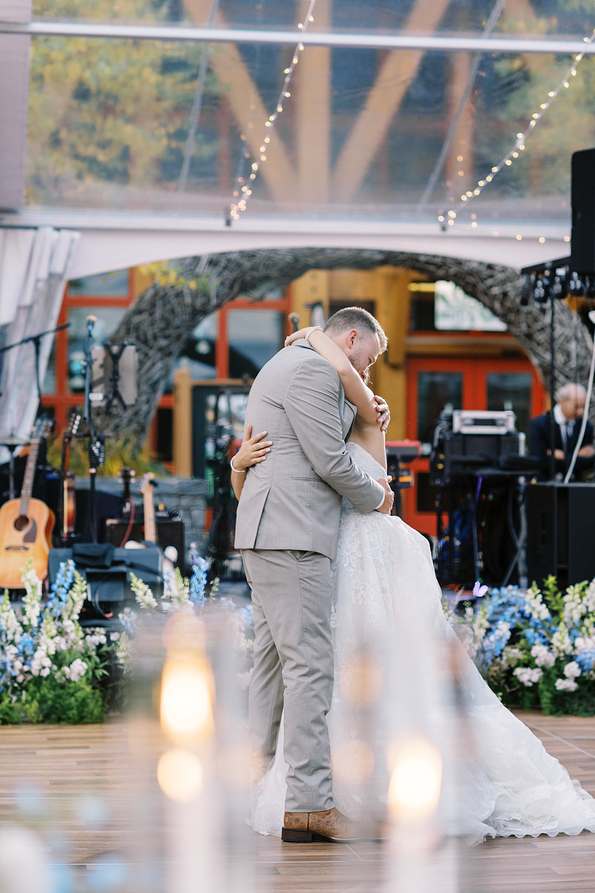 Bride and groom hold each other close while dancing for Lynne Reznick Photography
