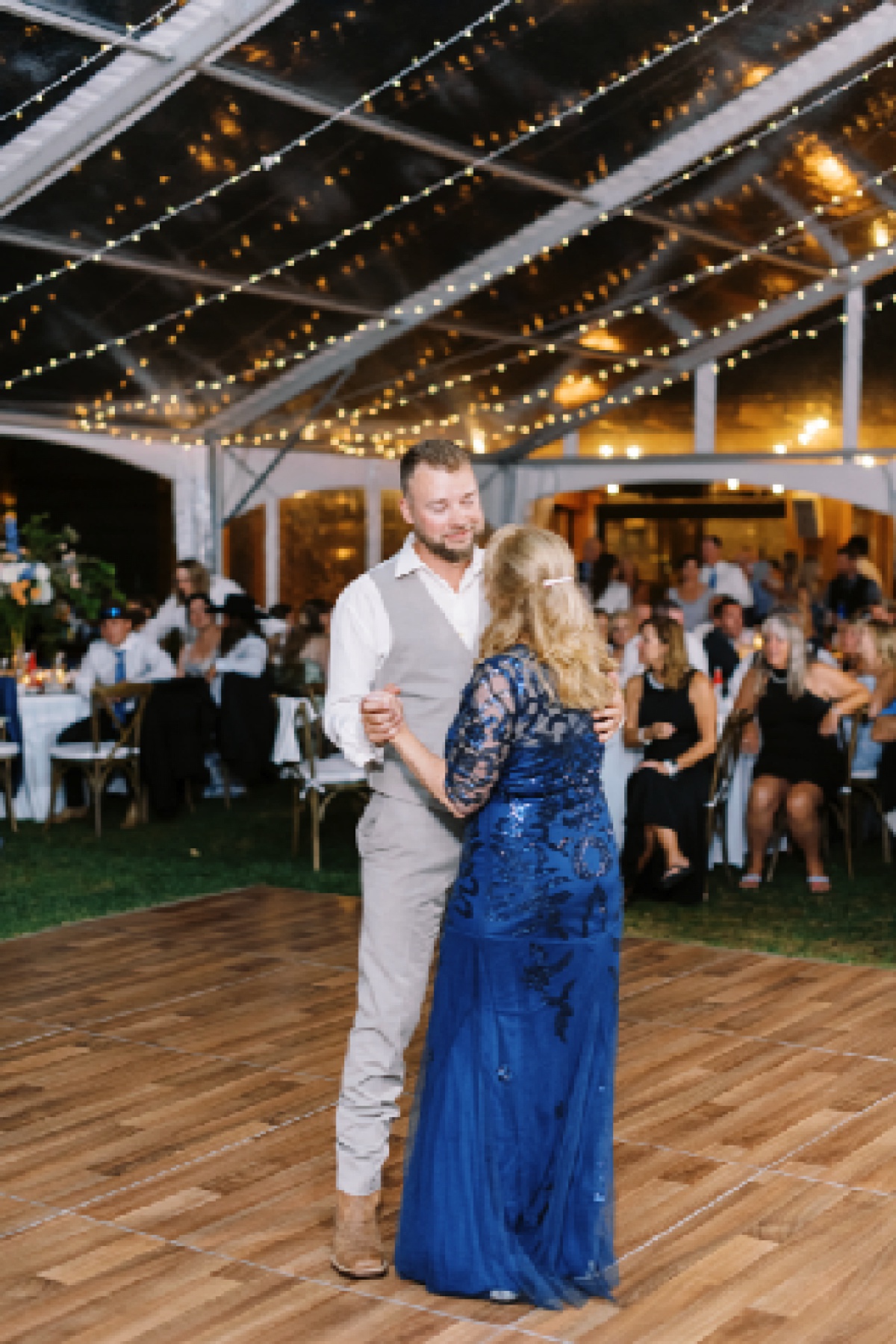 Mother and son dance together at The Lodge at Spruce Peak