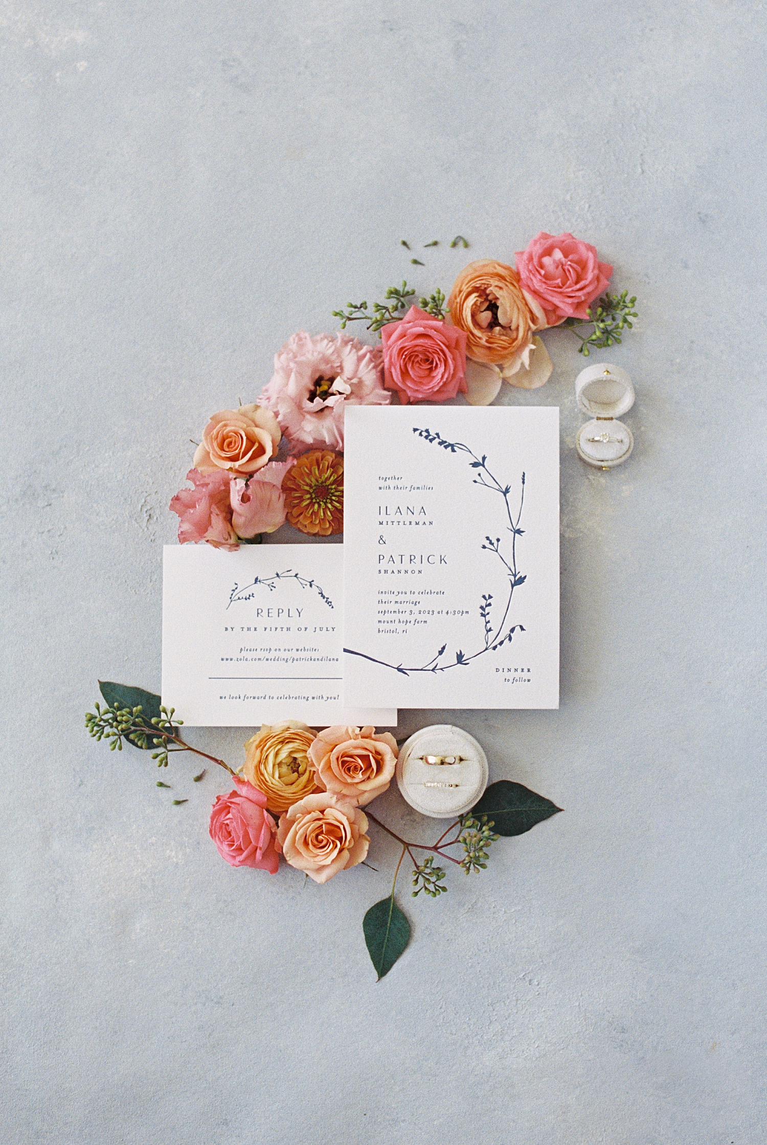 simple black and white invitations on flowers by New England Wedding Photographer