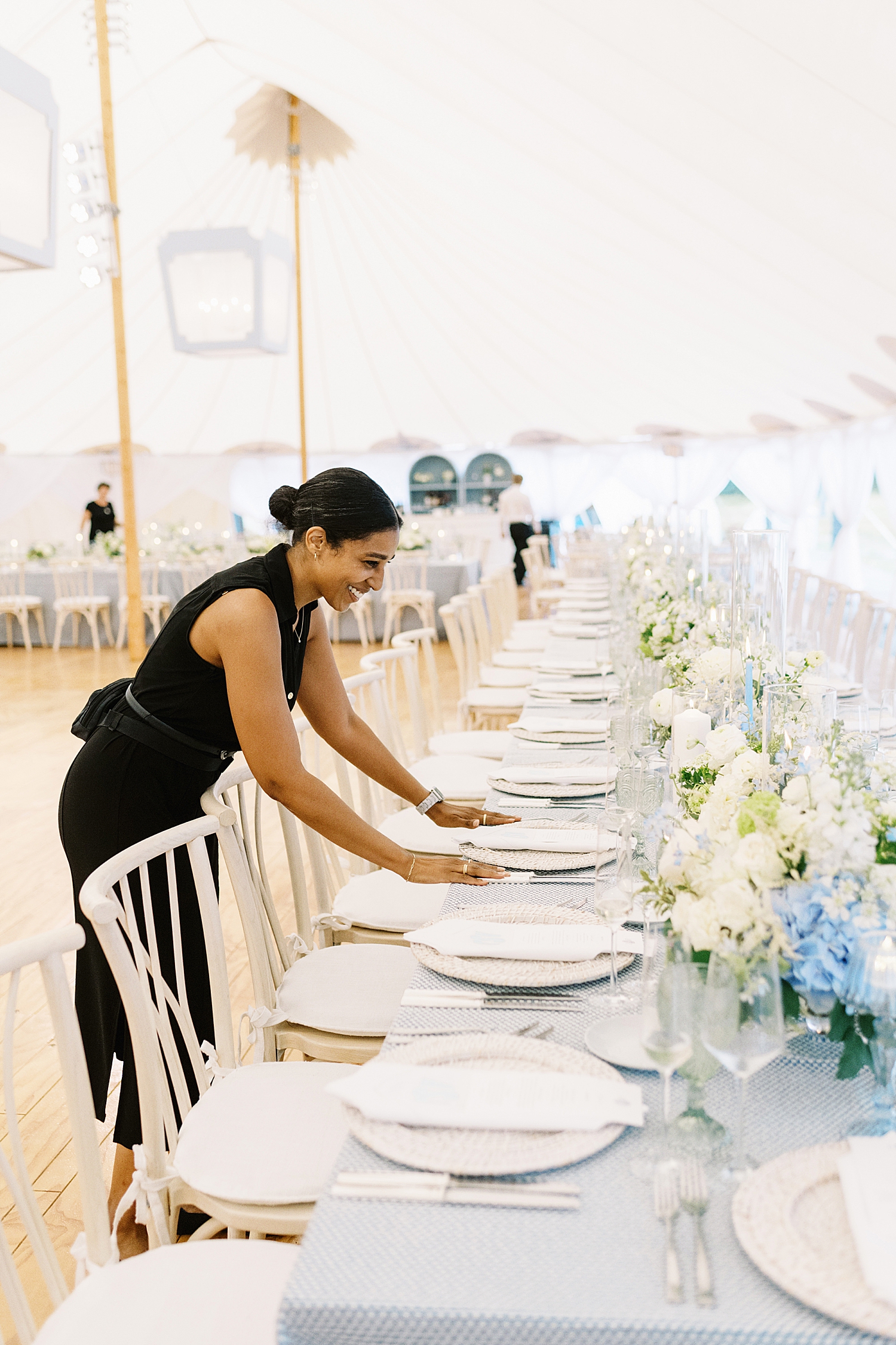 planner sets plate settings by Cape Cod wedding photographer