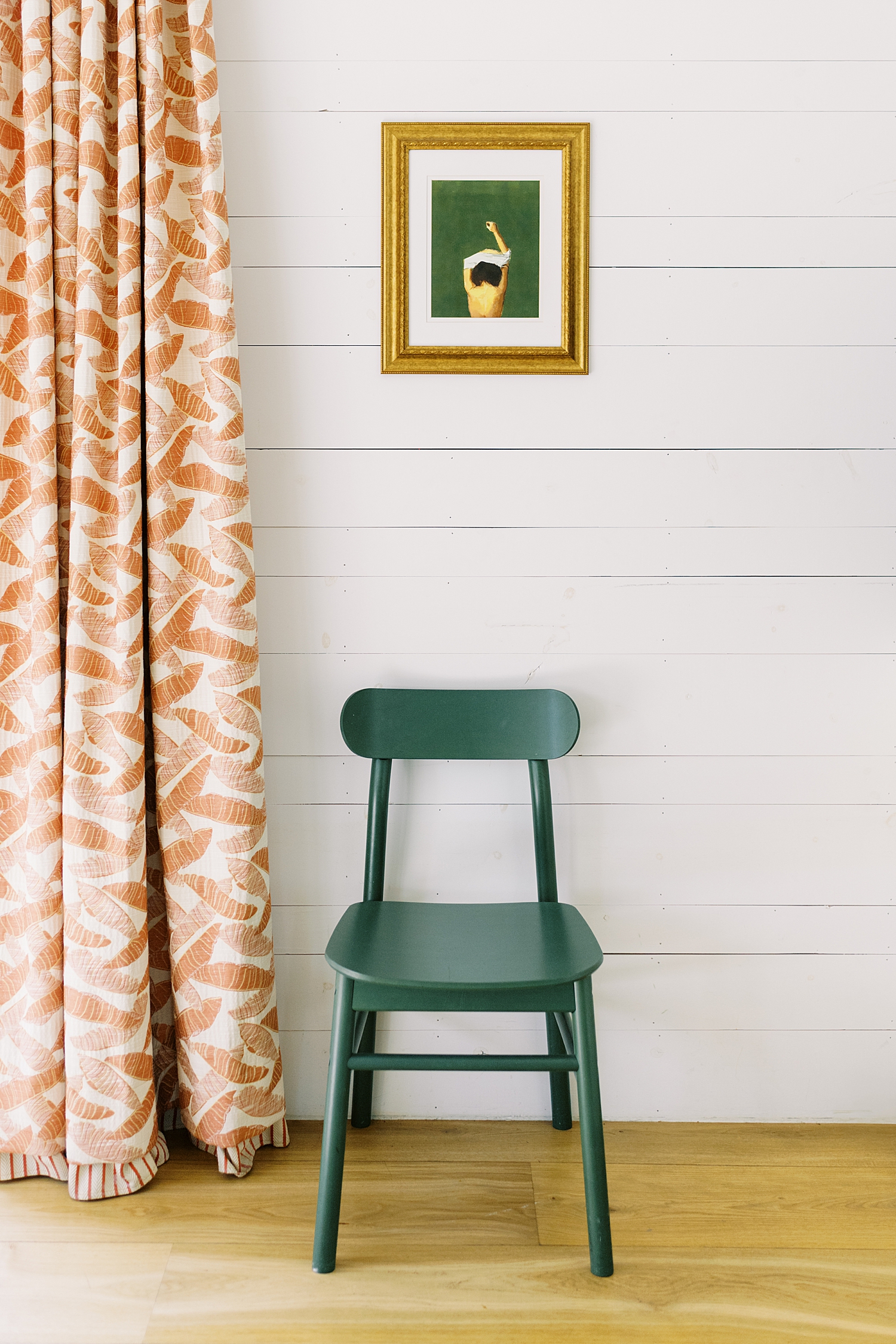 green chair sits against shiplapped wall by Austin wedding photographer