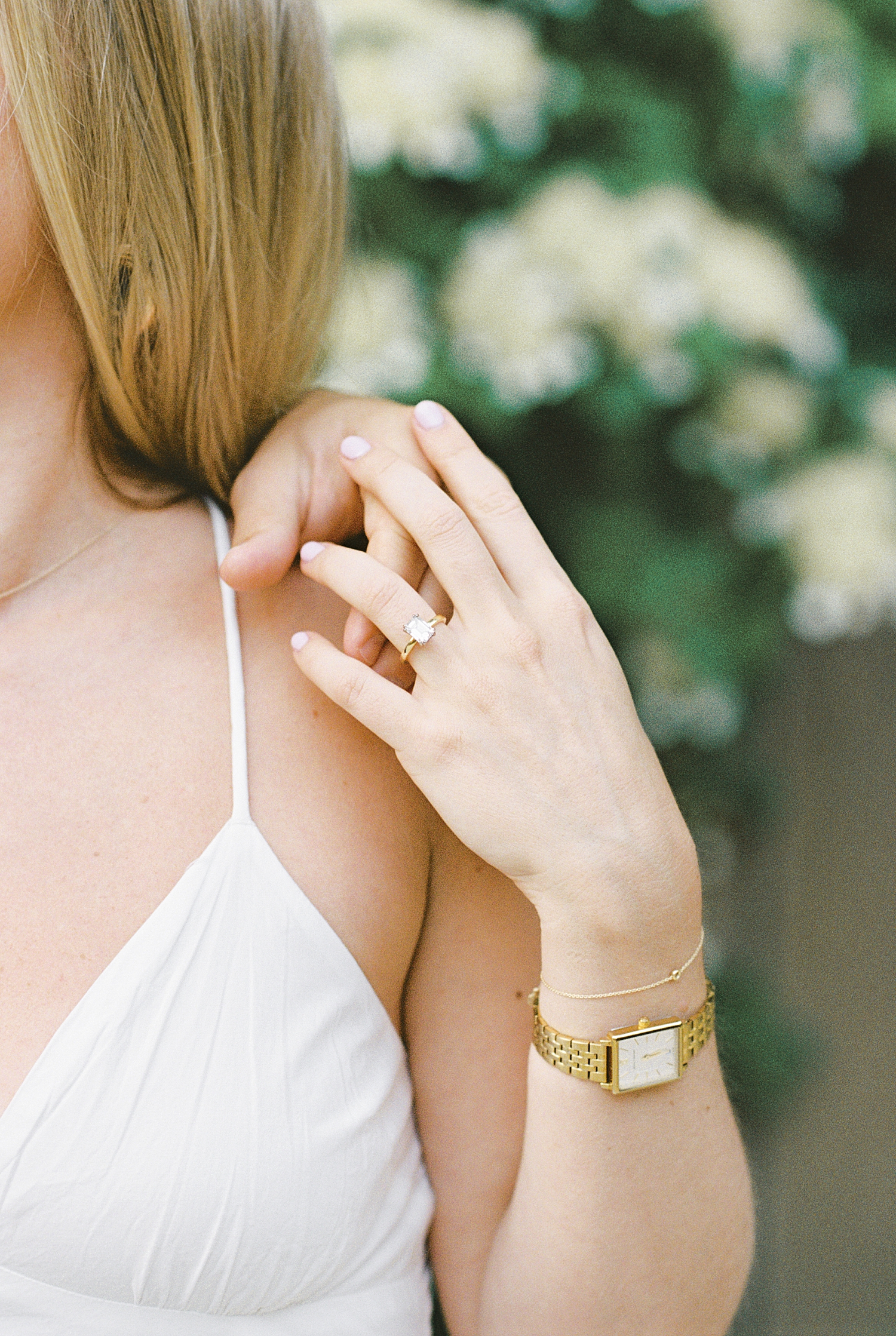 diamond ring on fiancé's finger by New England wedding photographer
