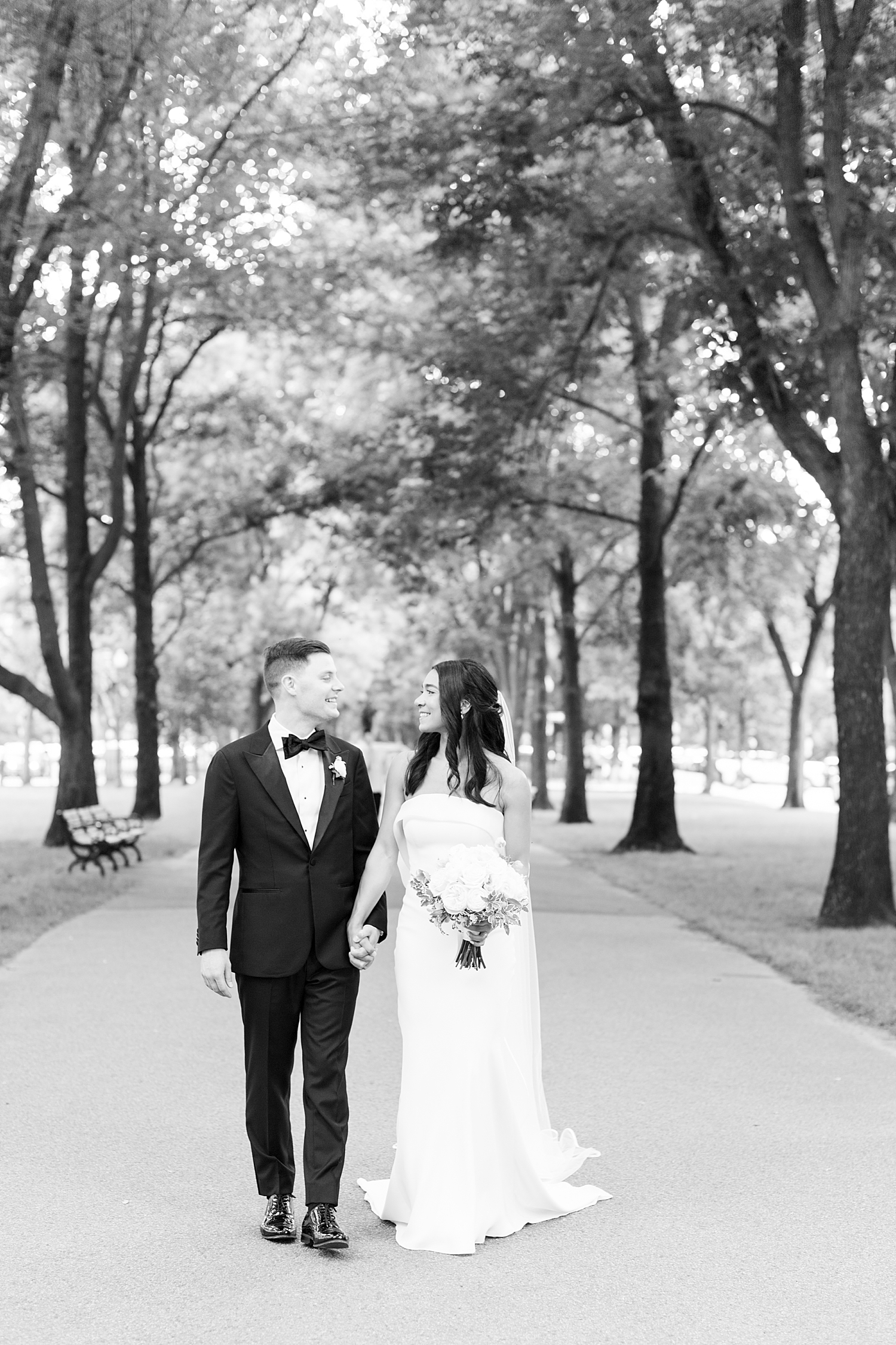 couple walks in park after their ceremony by Lynne Reznick Photography