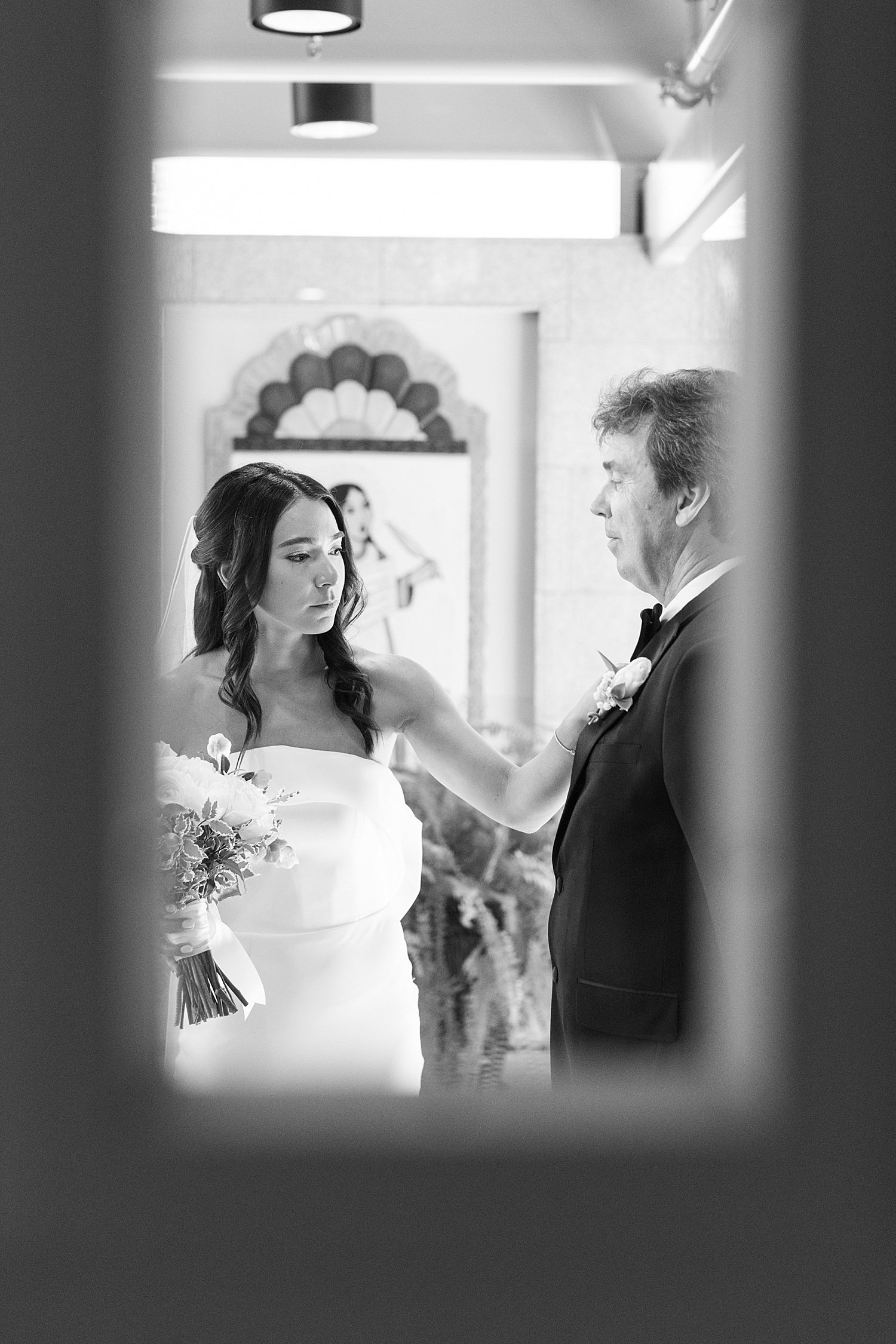 bride adjusts dad's bowtie before walking down the aisle by Lynne Reznick Photography