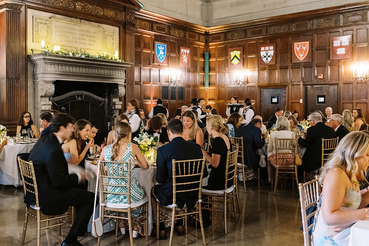 guests gather for dinner in hall at Havard Club of Boston