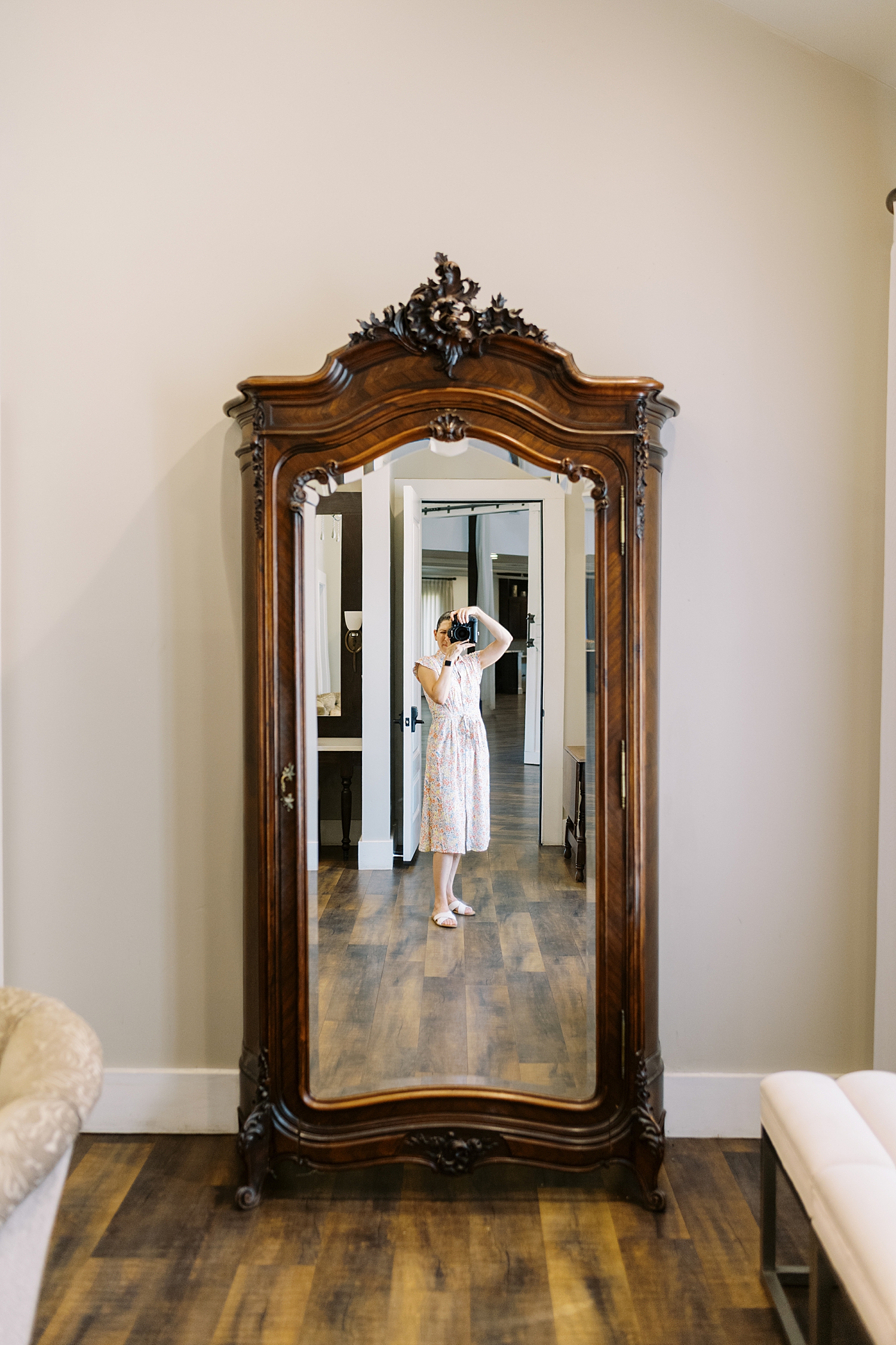 Lynne Reznick photography's self portrait in wardrobe mirror