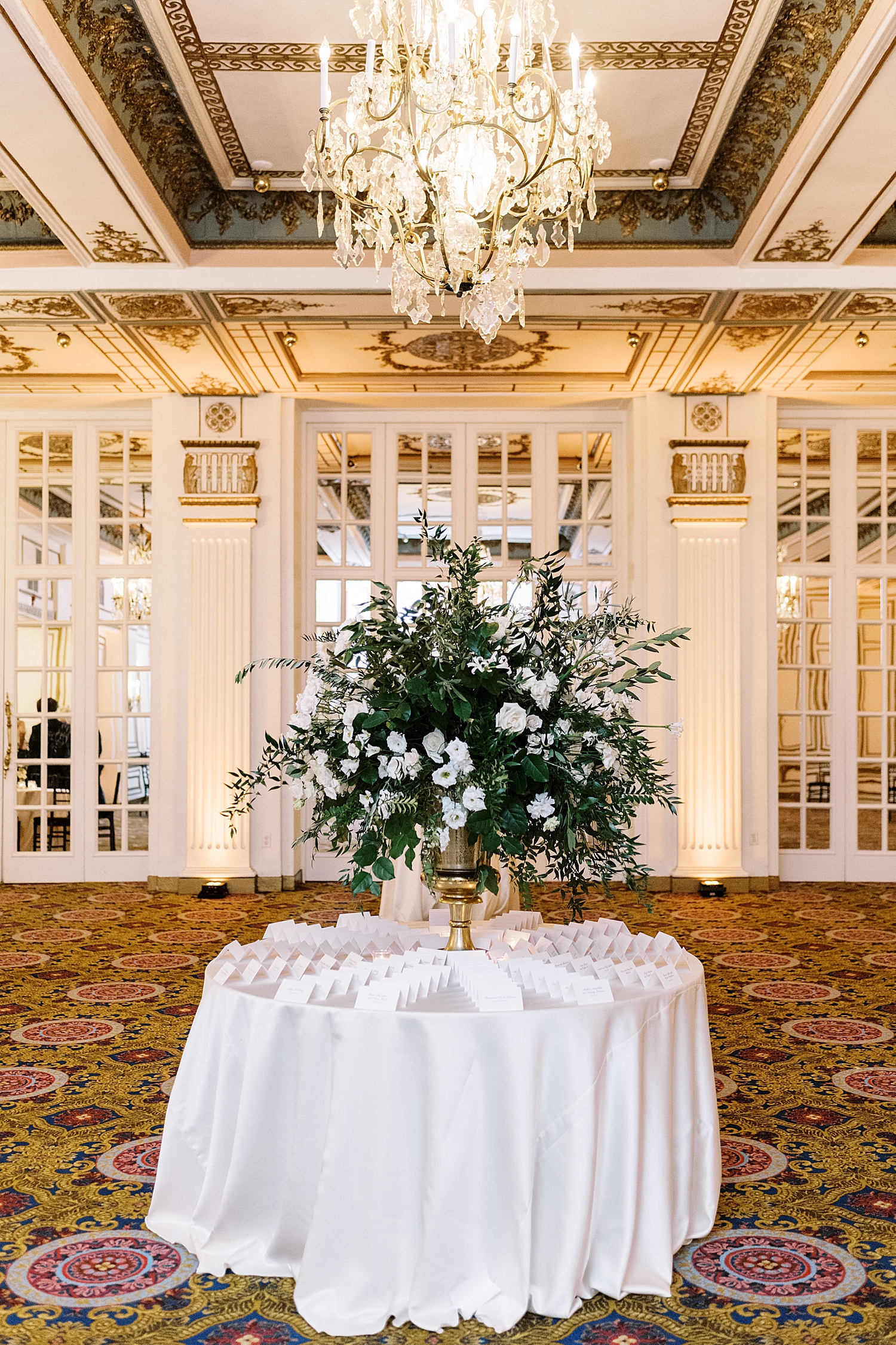 table with large centerpiece and name plates by Lynne Reznick Photography