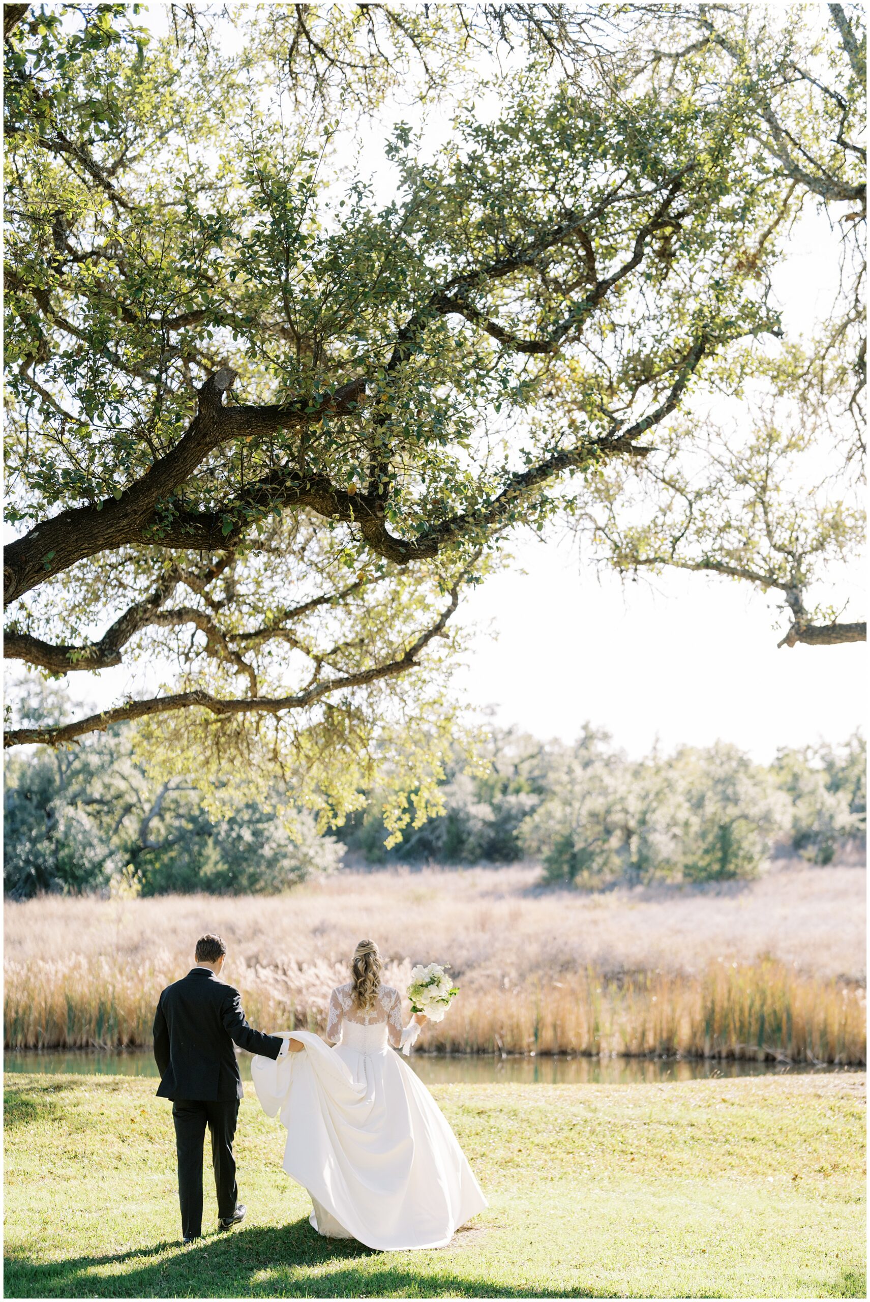 Golden hour couple portraits with oak trees at Addison Grove Hill Country wedding venue