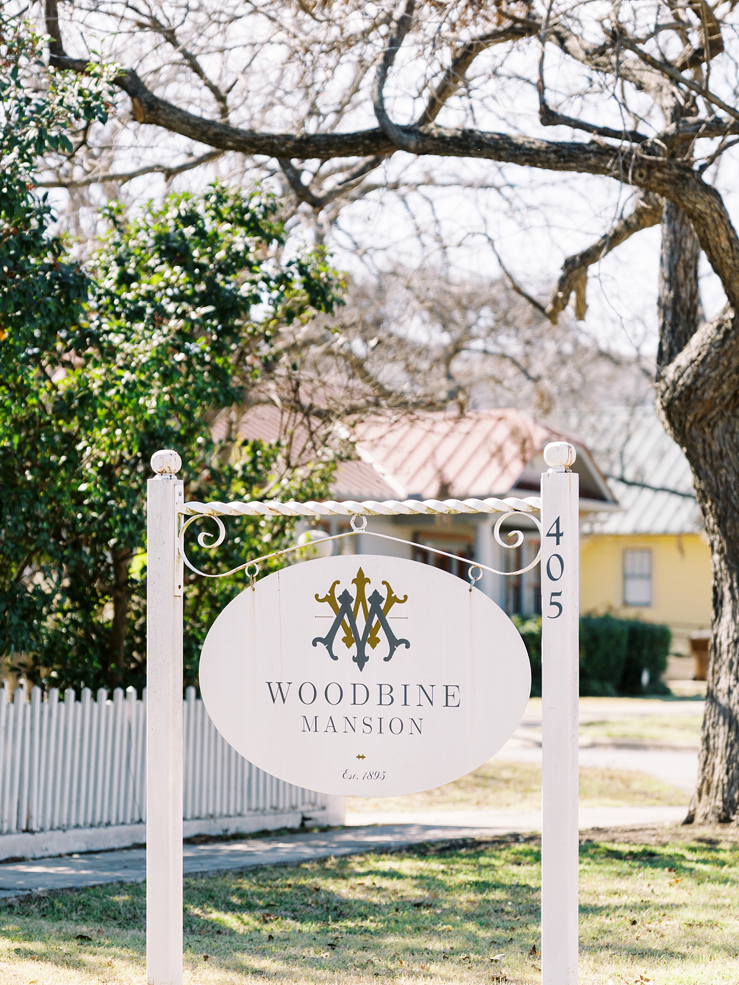 sign out front of historic manor by Austin wedding photographer