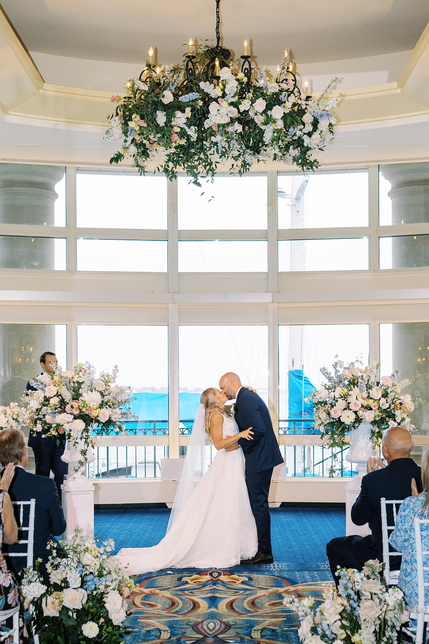 newlyweds share a kiss during ceremony by New England wedding photographer